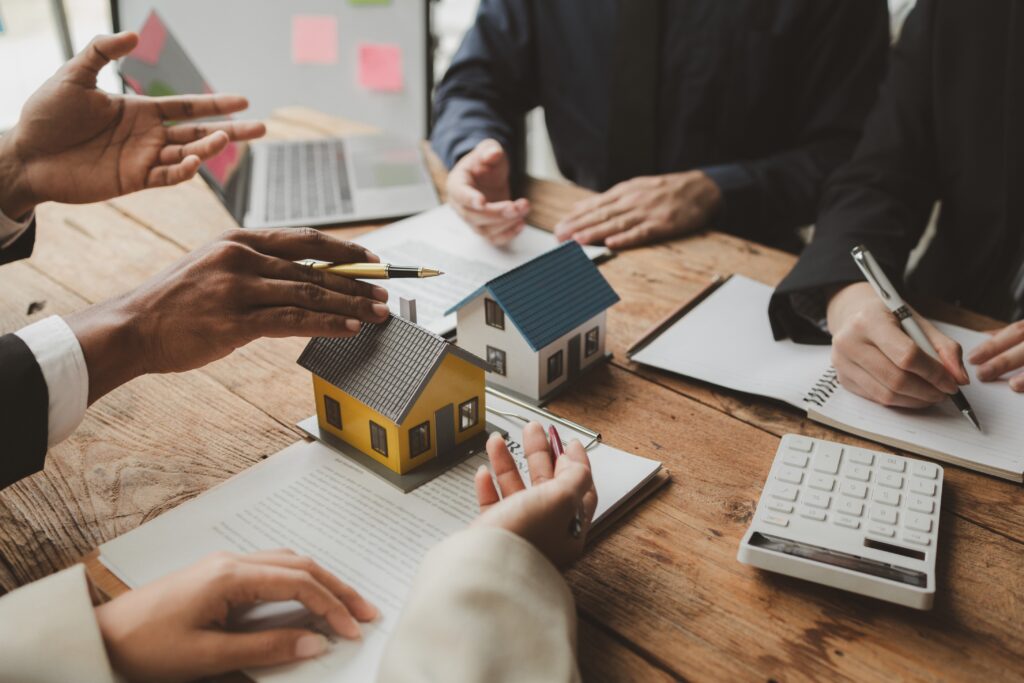 business meeting discussing home ownership and rea 2026 01 07 01 02 23 utc 1 - Bridging Loan vs Traditional Mortgage: Which Property Finance Option Gets You the Keys Faster?